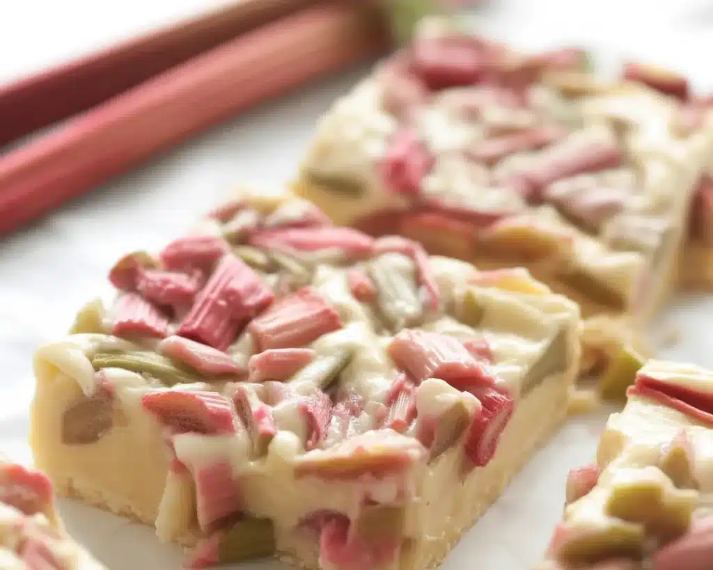 Rhubarb Custard Bars with a buttery crust and creamy rhubarb filling on a plate.