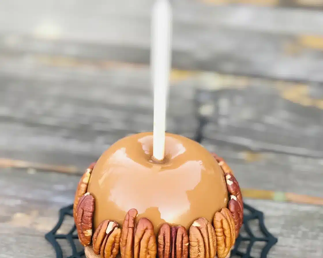 Homemade caramel apple Halloween candy decorated for festive celebrations.