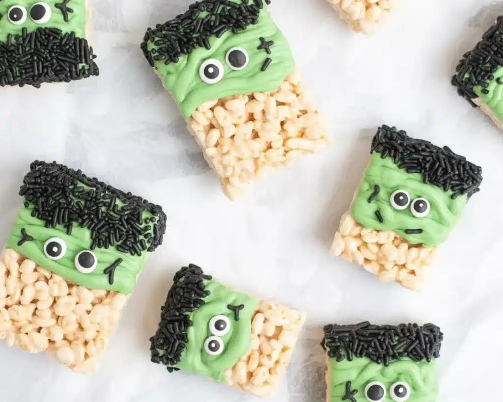 Frankenstein Halloween Rice Krispie Treats decorated with green candy melts and chocolate.