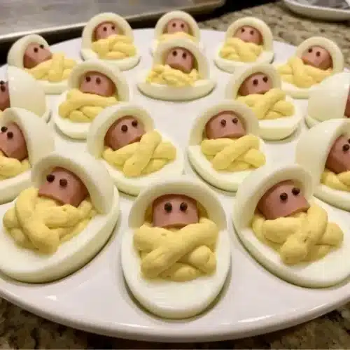 Delicious Sleeping Baby Deviled Eggs served on a decorative platter.