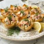 Crisp wonton cups filled with fresh seafood and dill, a perfect appetizer.