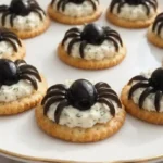 Easy Halloween crackers with olive and herb cream cheese for festive snacks