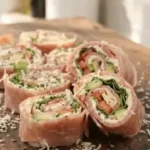 Delicious low-carb pinwheels with cream cheese and avocado on a serving platter.